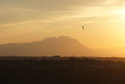 Scenic view of mountains at sunset