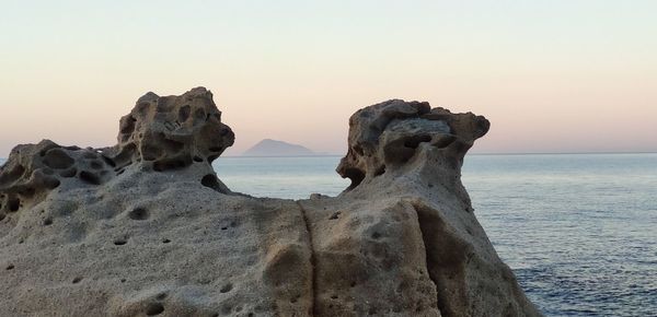 Scenic view of sea against clear sky during sunset