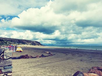 Scenic view of calm sea against cloudy sky