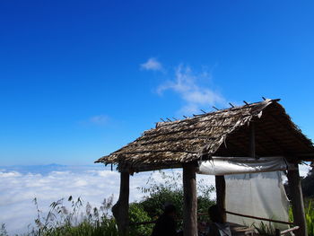 Low angle view of traditional building against blue sky