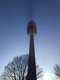 Low angle view of communications tower against sky