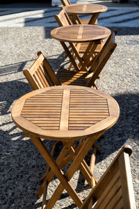 High angle view of chairs and table at sidewalk cafe