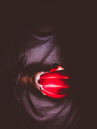 Close-up of human hand on bed