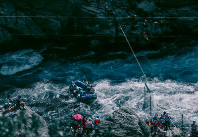 High angle view of people in river