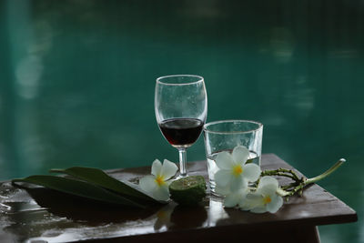 Glass of white and wine on table