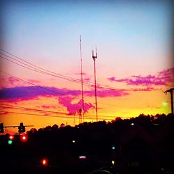 Silhouette of power lines at sunset