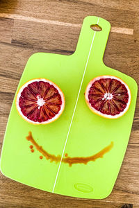 High angle view of oranges on cutting board