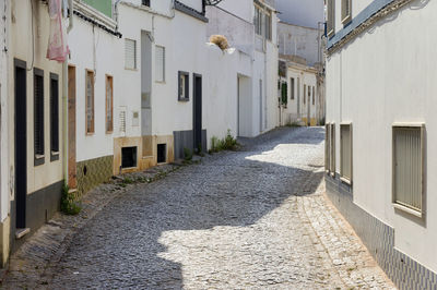 Narrow pathway along built structures