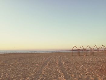 Scenic view of beach against clear sky