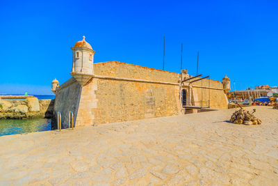 View of fort against blue sky