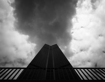 Low angle view of building against cloudy sky