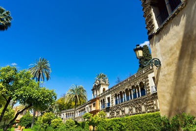 Low angle view of building against clear blue sky