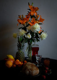 Orange flower vase on table