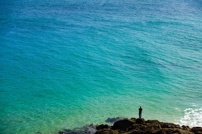 High angle view of man standing at beach