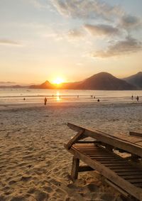 Scenic view of beach against sky during sunset