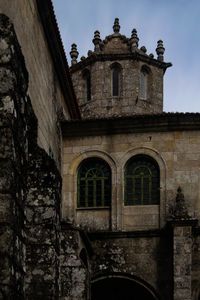 Low angle view of old building against sky