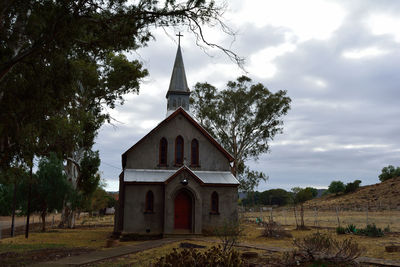 View of bell tower against cloudy sky
