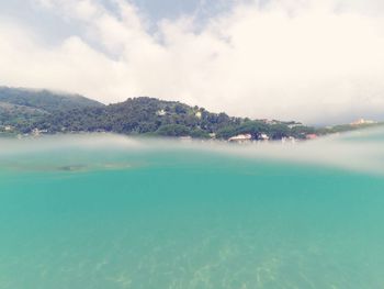 Scenic view of sea against cloudy sky