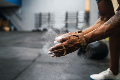 Low section of man holding powder