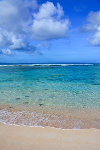 Scenic view of sea against blue sky