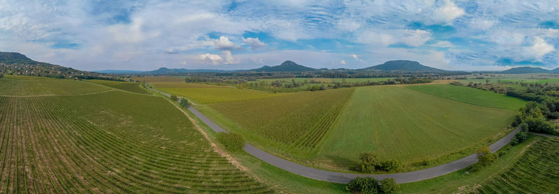 Panoramic shot of agricultural field against sky