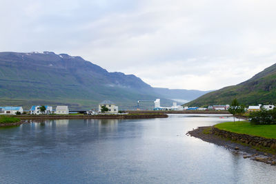 Scenic view of lake and mountains against sky