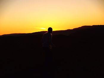 Silhouette of people at sunset