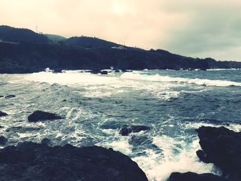 Scenic view of sea against sky during winter