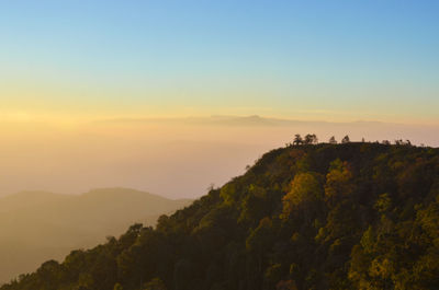 Scenic view of mountains against sky during sunset