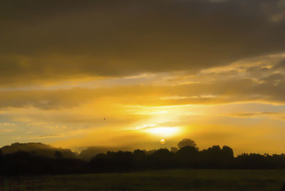 Scenic view of silhouette landscape against sky during sunset