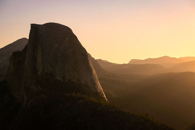 Scenic view of mountains against sky during sunset