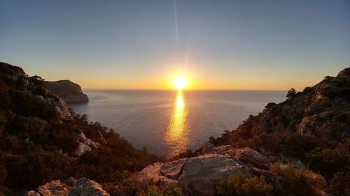 Scenic view of sea against sky during sunset