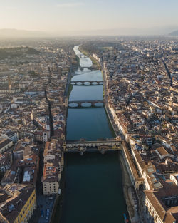 Aerial view of florence along the arno river and the old town from above, tuscany, italy,