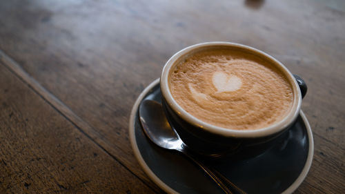 High angle view of cappuccino on table