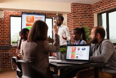 Group of business colleagues working at office