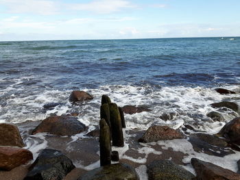 Waves breaking on shore