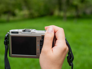 Close-up of hand holding camera