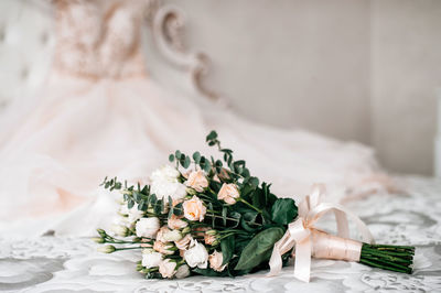 Close-up of wedding rings on table