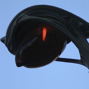 Low angle view of illuminated blue sky