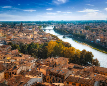 High angle view of river amidst buildings in city