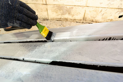 High angle view of man working on metal