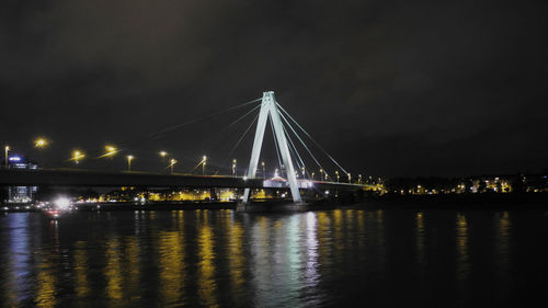 Low angle view of suspension bridge at night