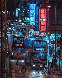 Illuminated city street at night