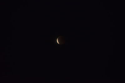 Low angle view of moon against sky at night