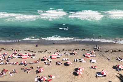 High angle view of beach umbrellas on sunny day