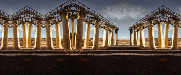Panoramic shot of columns against sky