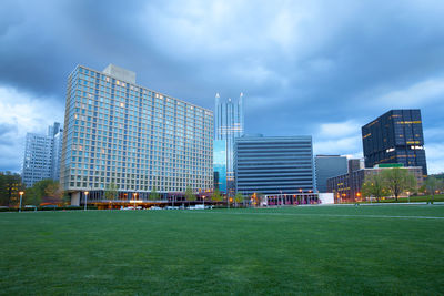 Modern buildings in city against sky