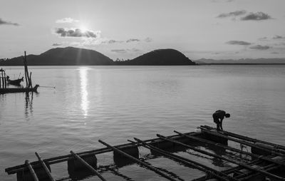 Scenic view of sea against cloudy sky