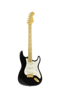 Guitar against white background