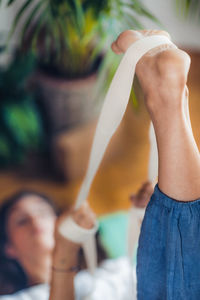 Young woman exercising with band